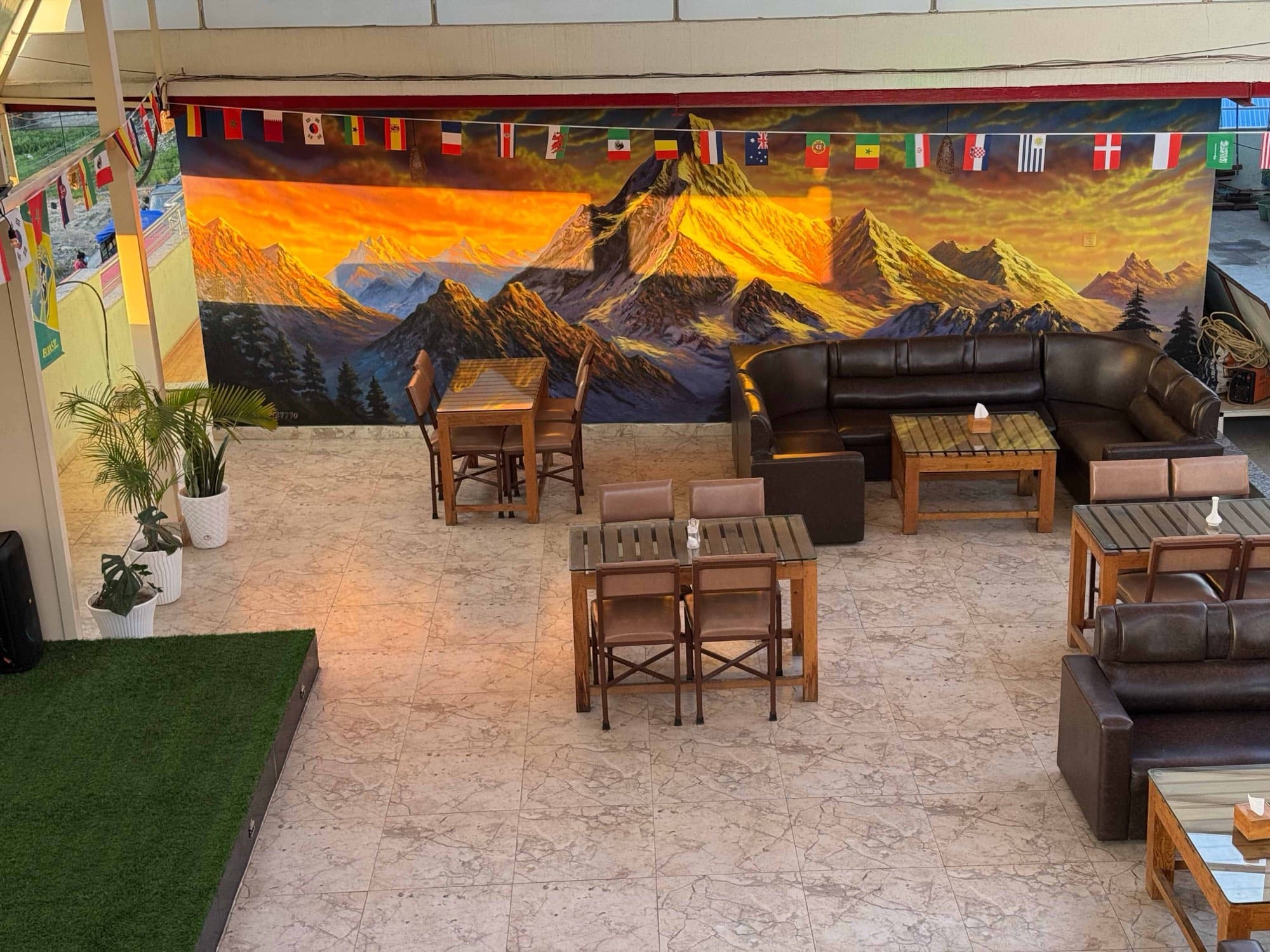 Lounge seating beneath the golden Everest artwork