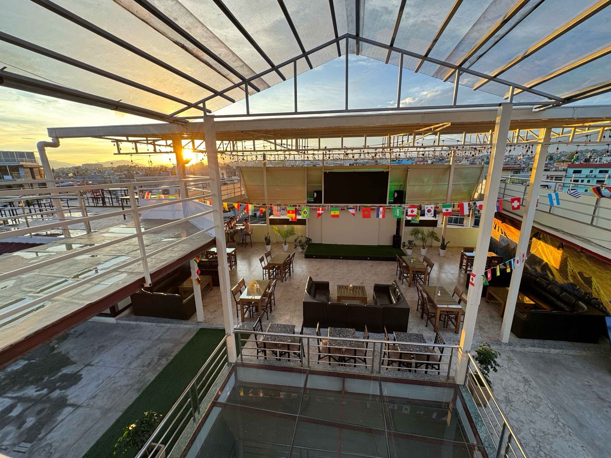 Open-air rooftop seating at dusk